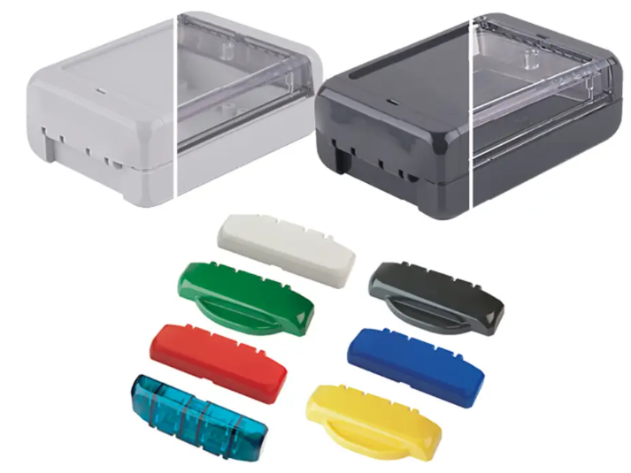 Enclosures with interchangeable coloured covers